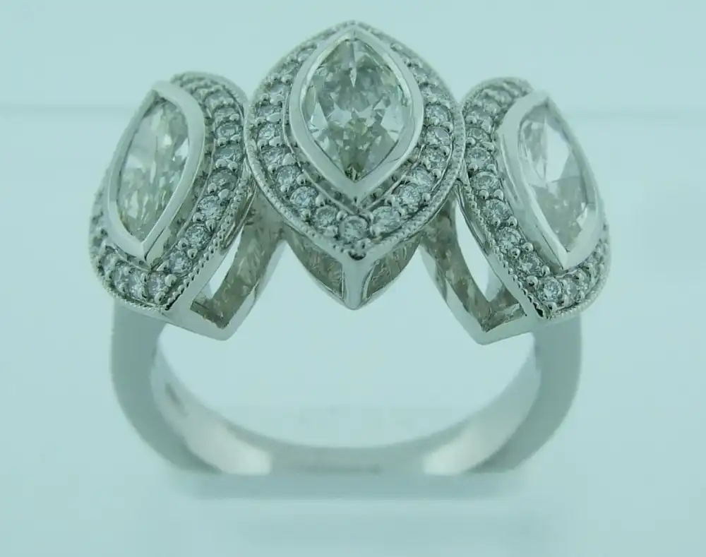 Three-Stone Marquise Bezel with Pavé Halo