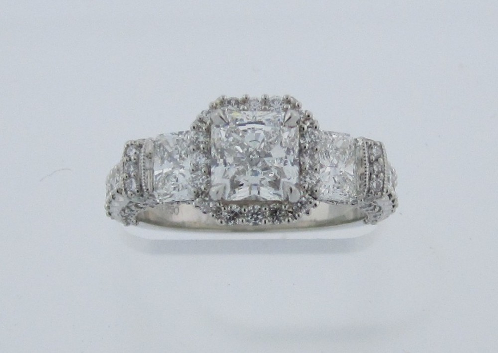 Radiant Three-Stone with Pavé Halo and Cathedral