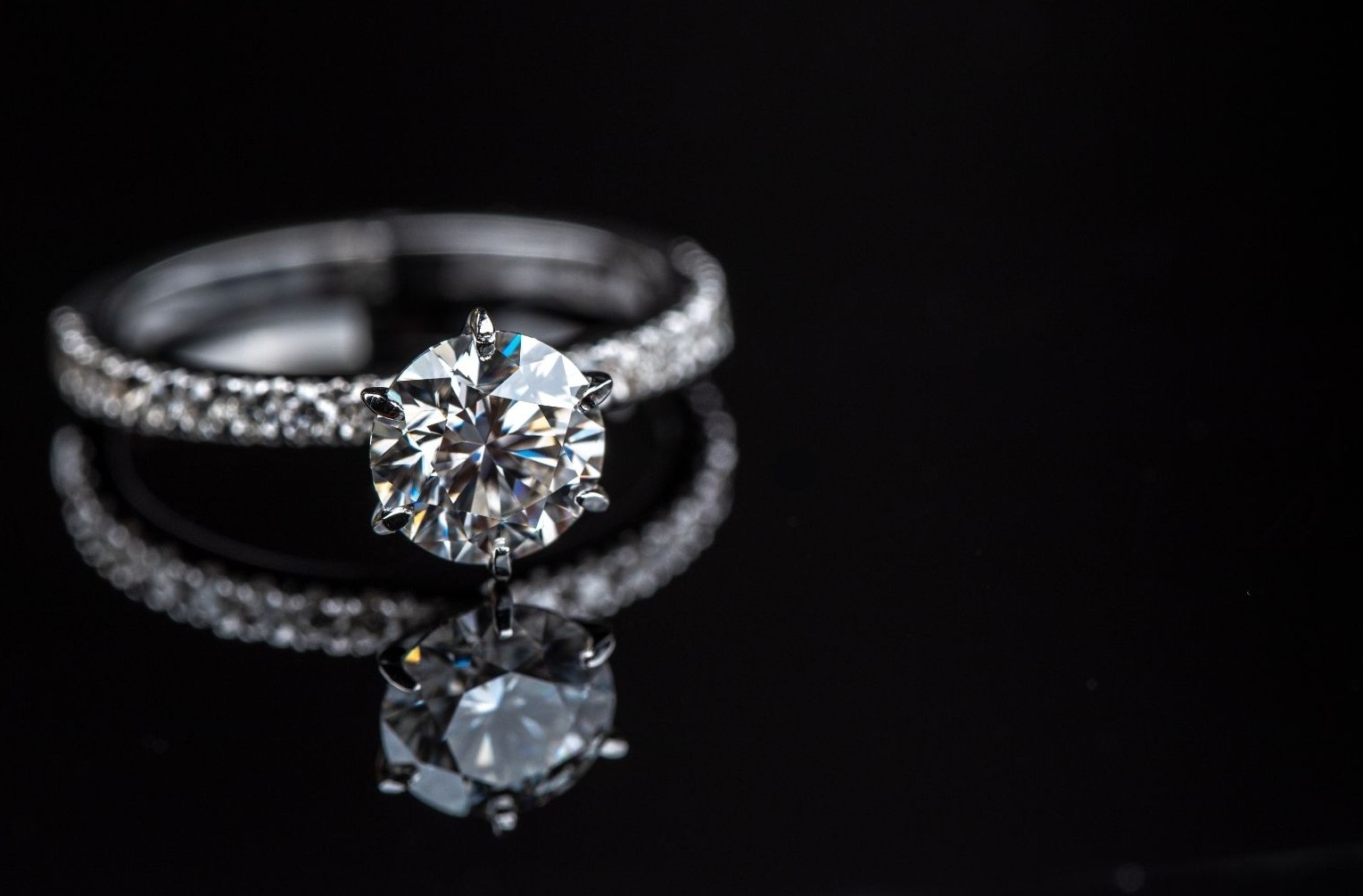 Diamond engagement ring on black background